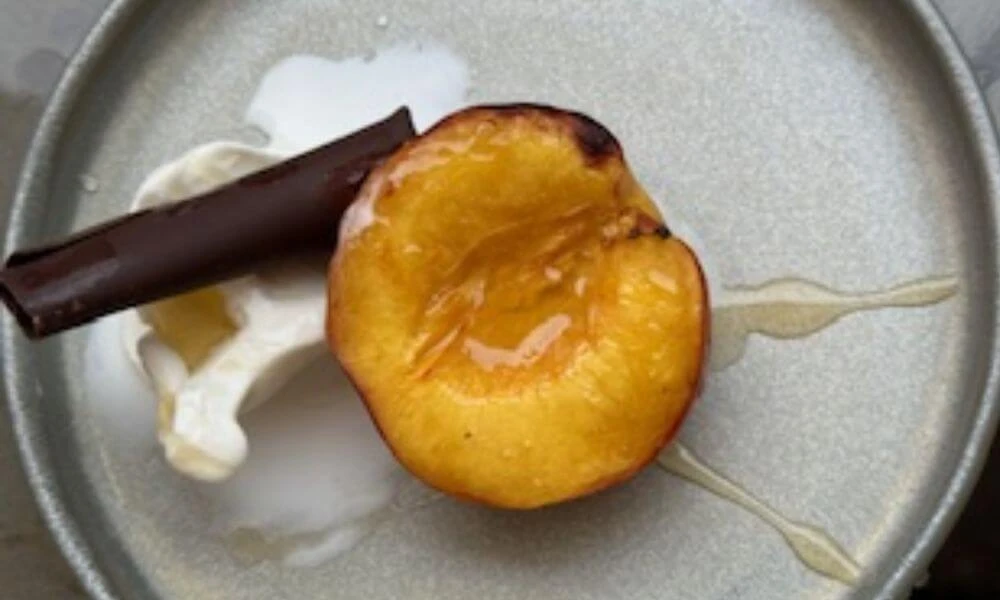 HONEY GRILLED PEACH TOPPED WITH VANILLA GELATO