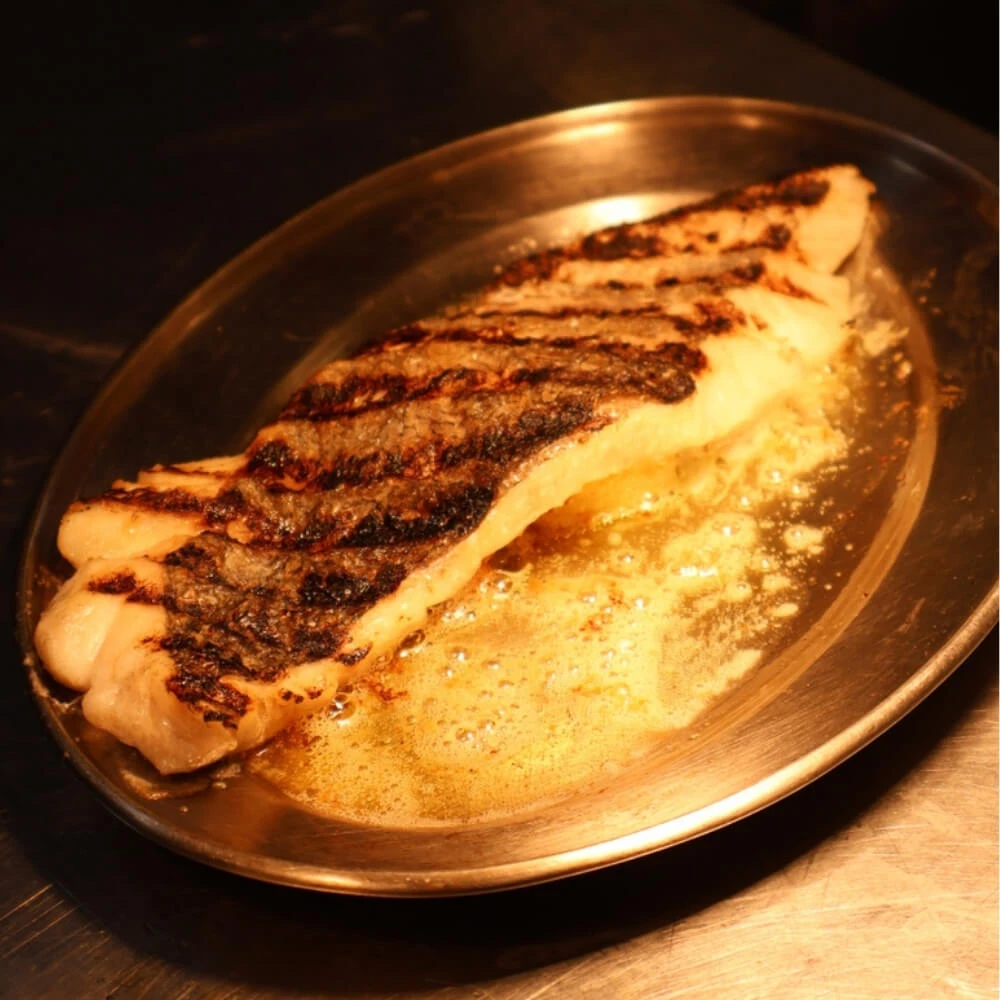 Pan fried hake fillet with a warm salad of roasted pumpkin and lentils and a red pepper hollandaise Image 1