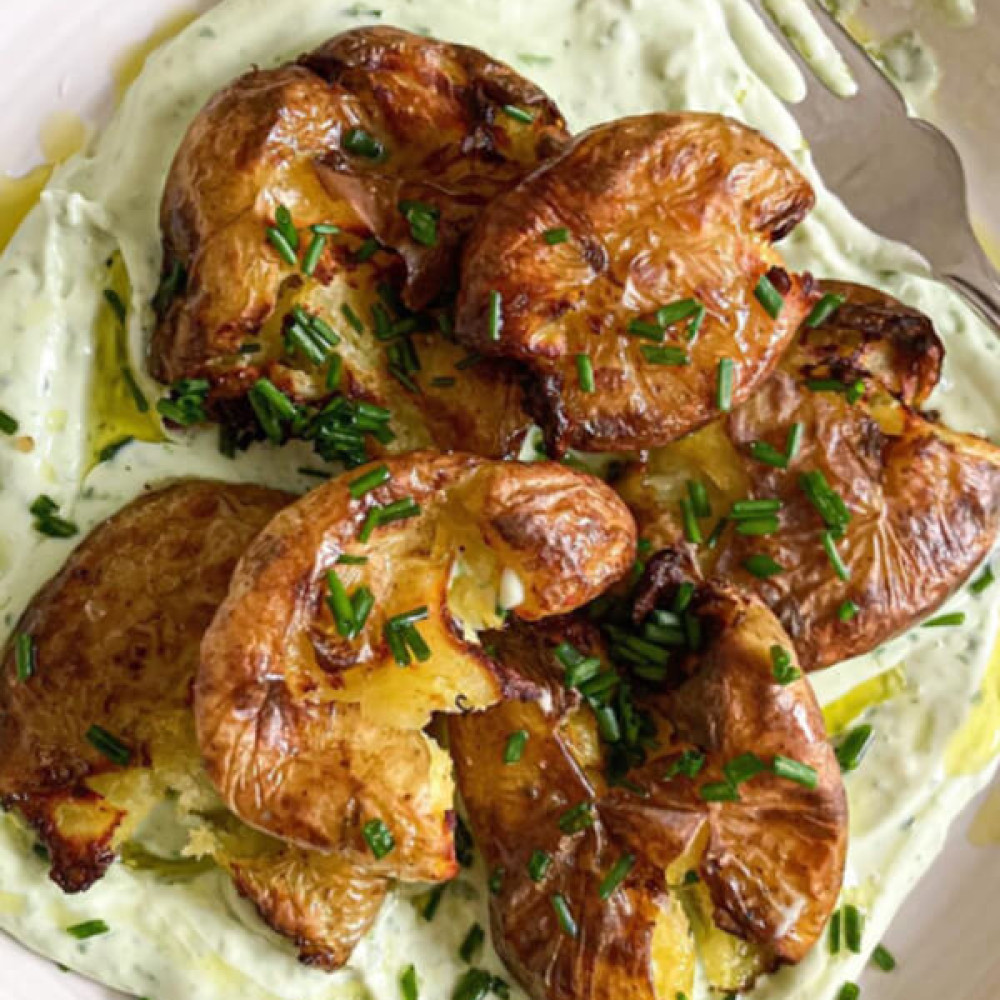 Crispy, smashed potatoes with a chive & wild garlic yoghurt Image 1