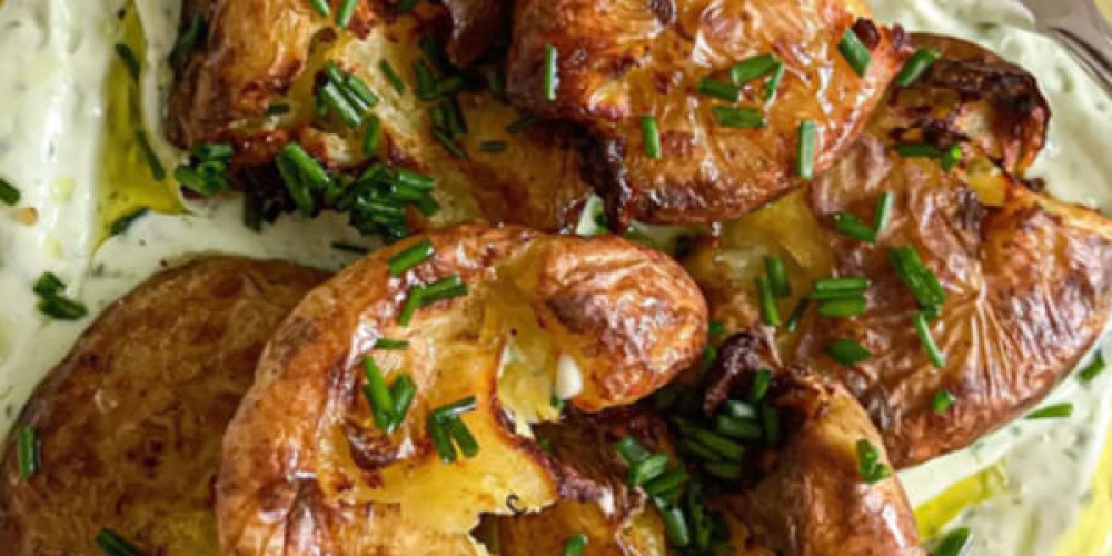 Crispy, smashed potatoes with a  chive & wild garlic yoghurt