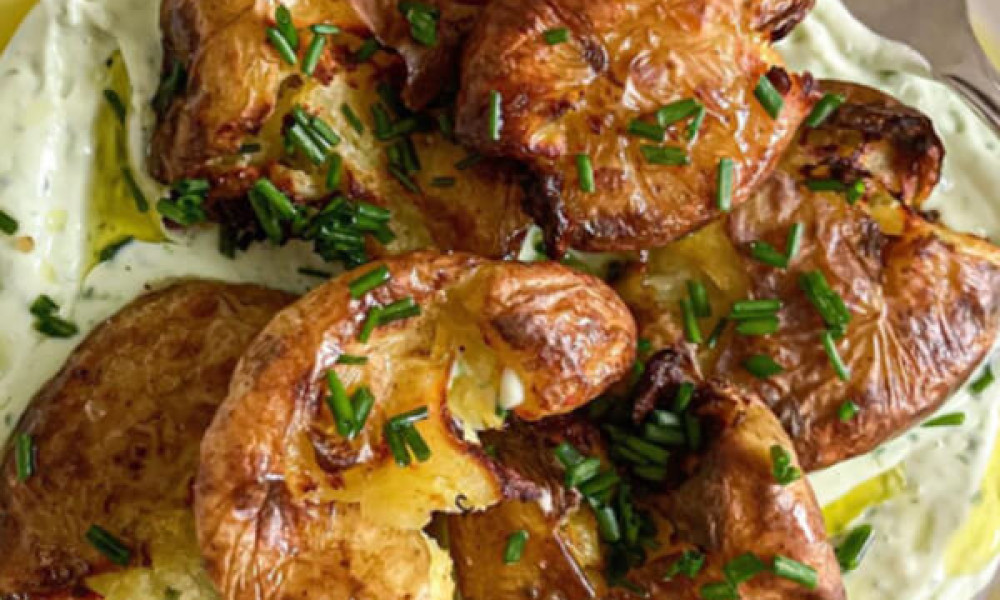 Crispy, smashed potatoes with a  chive & wild garlic yoghurt