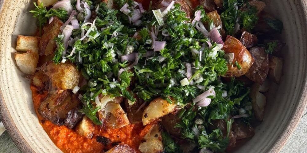 Crispy Smashed New Potatoes on Romesco Sauce